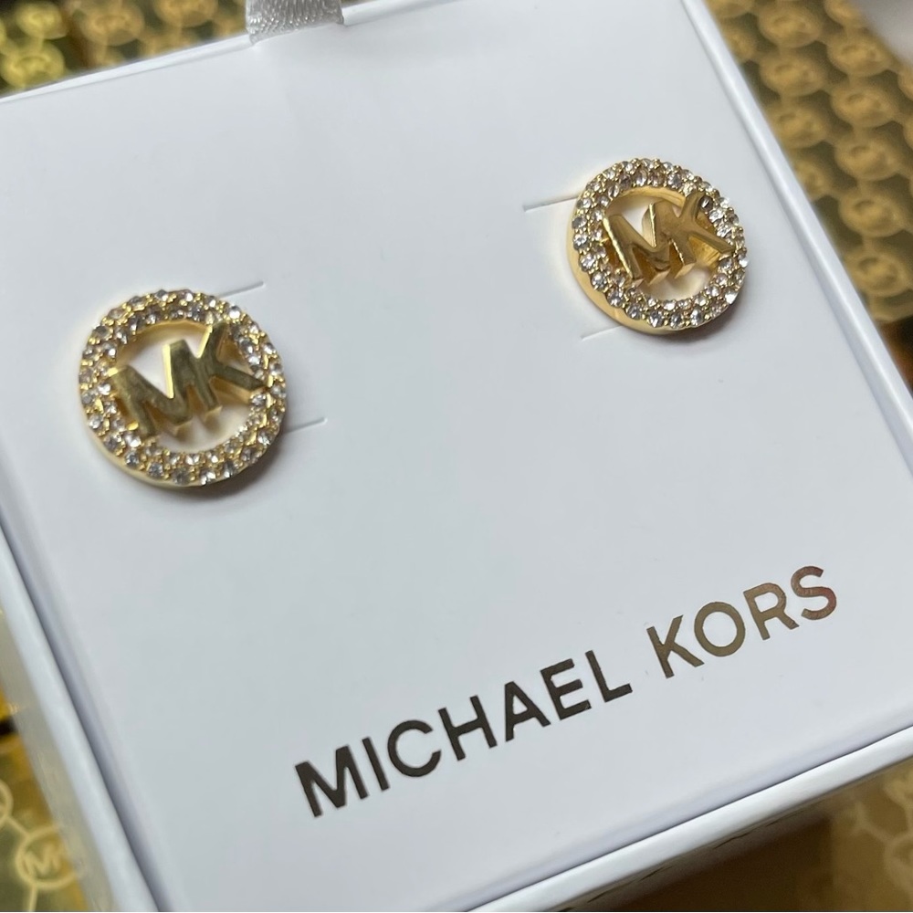 Michael Kors Gold diamond earrings .